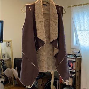 Grey vest with beige fur lining and detail